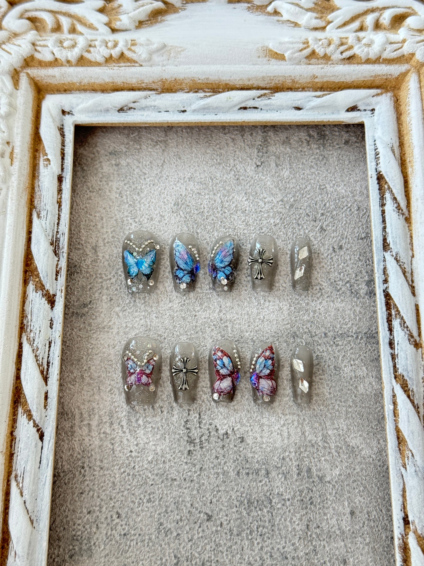 Medium length butterfly nails transparent grey blue and pink butterflies