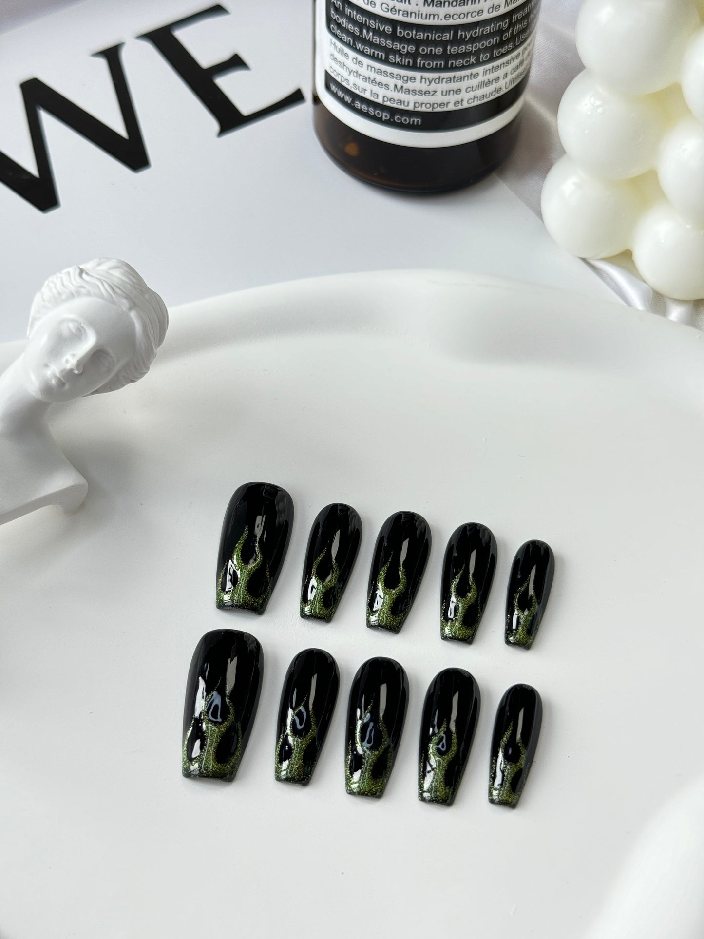 Long hand-painted fire nails black green