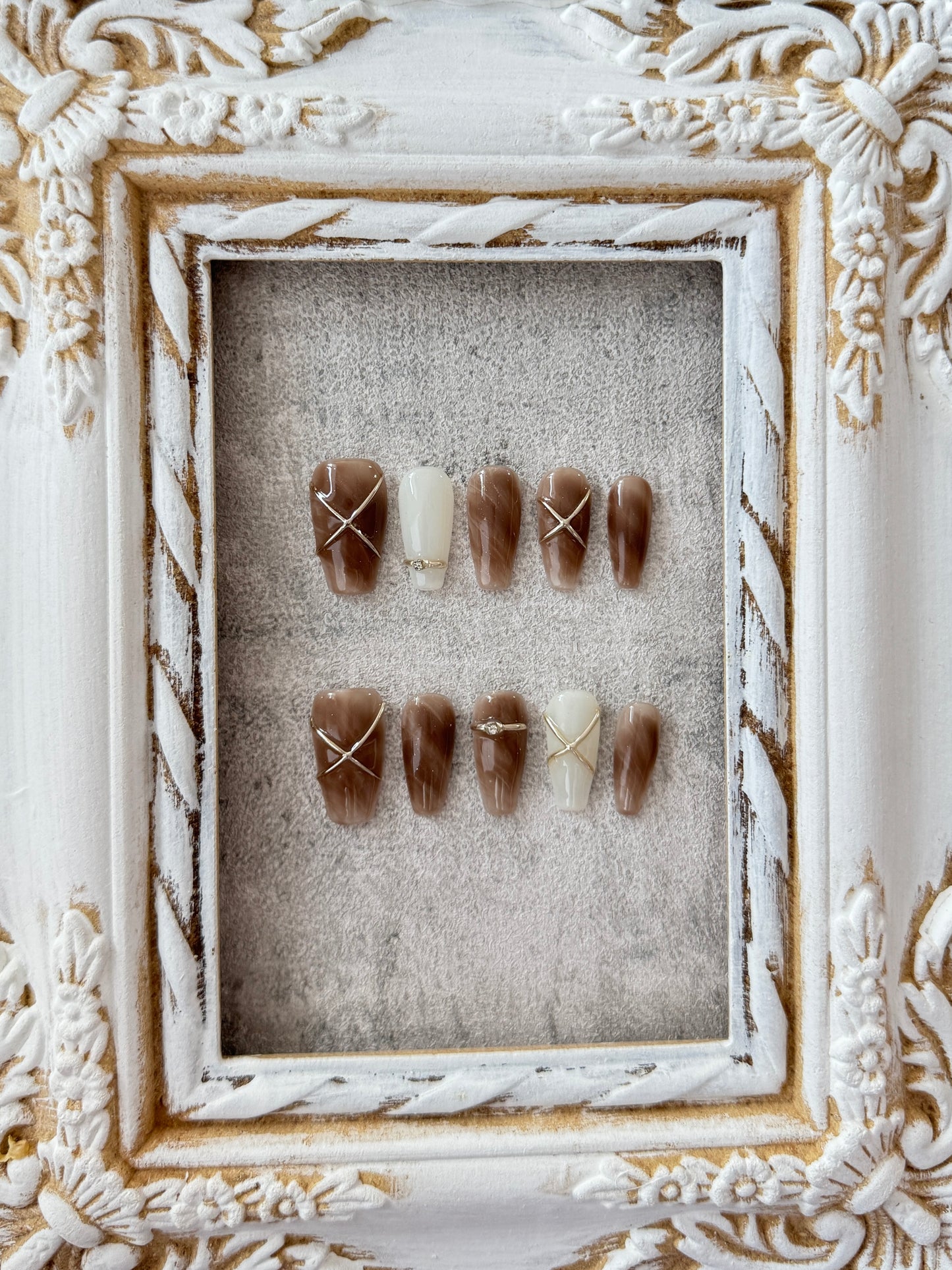 Long hand-painted marble nails brown