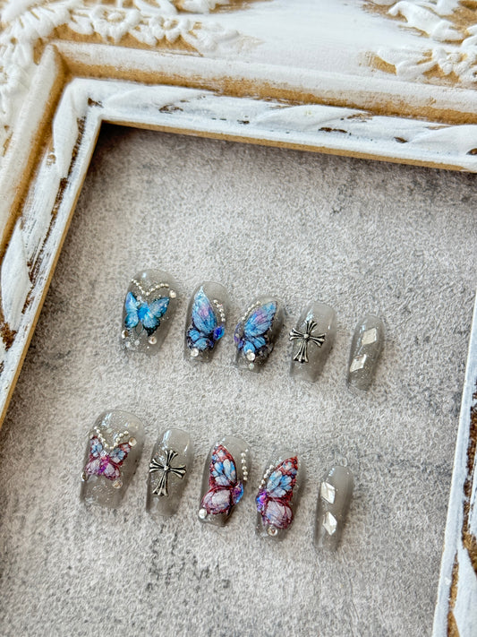 Medium length butterfly nails transparent grey blue and pink butterflies