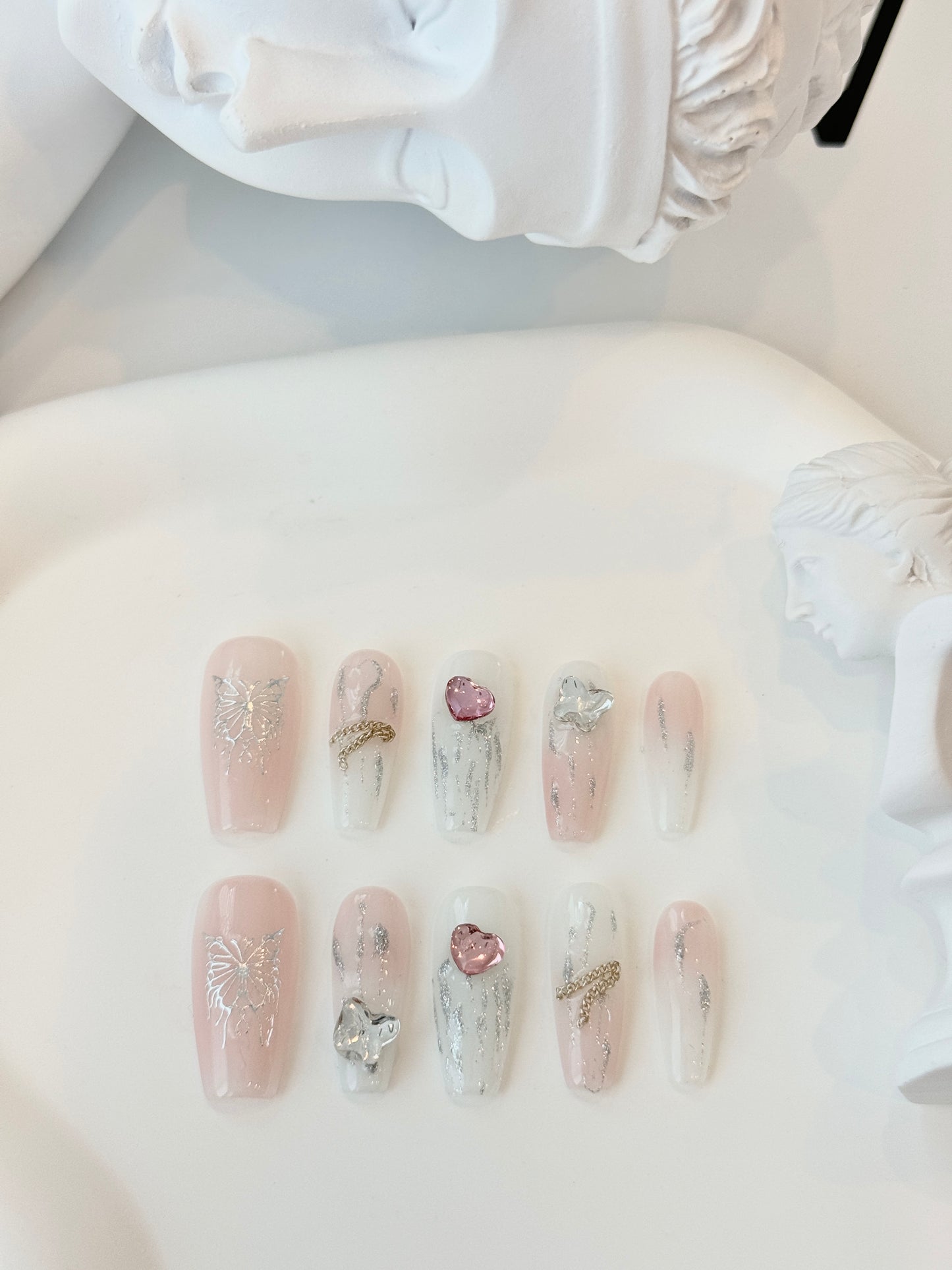 Long butterfly nails pink white