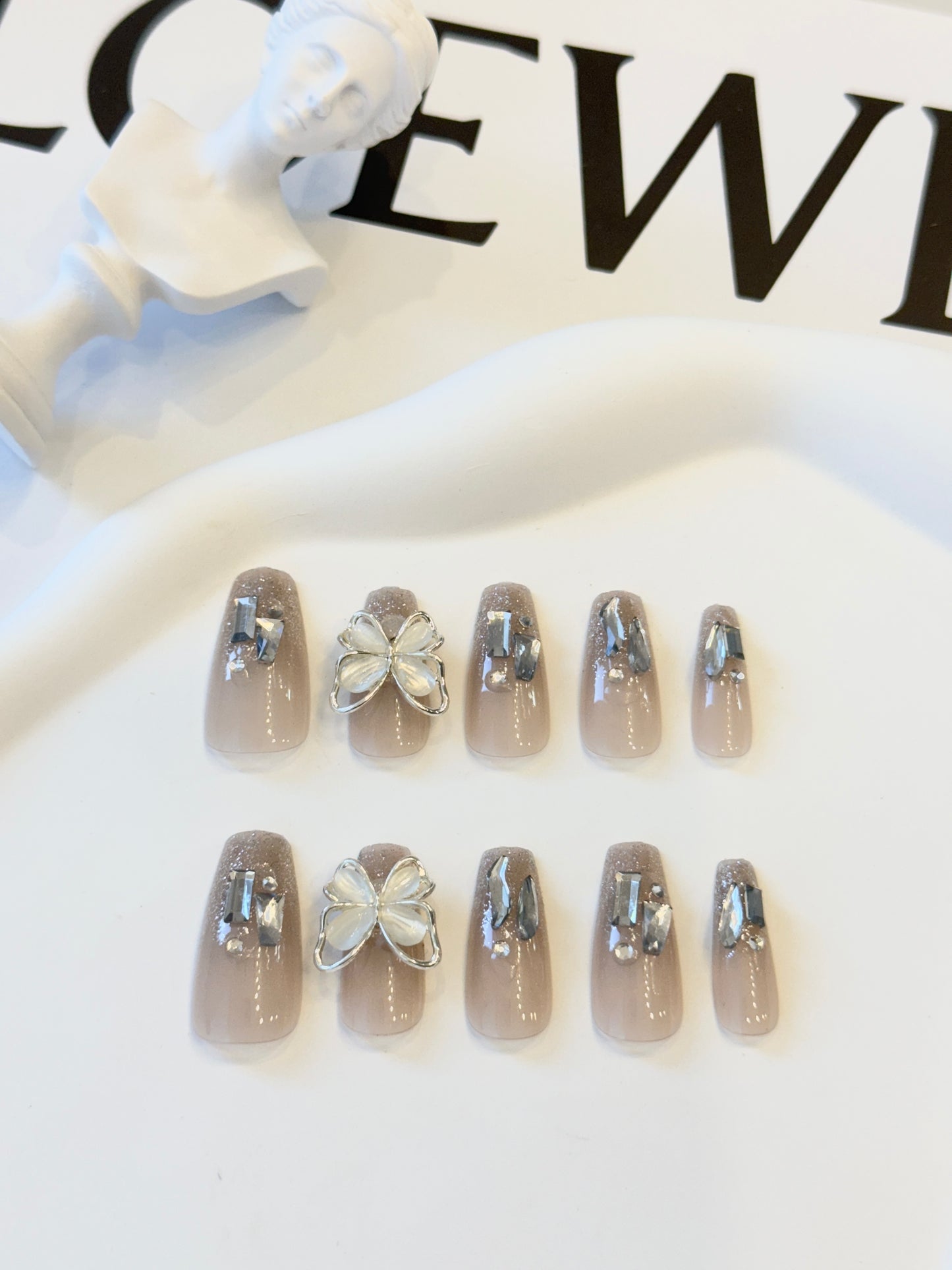 Long butterfly nails white